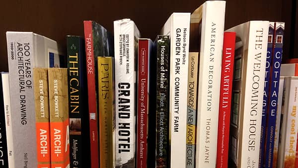 A shelf of bound books photographed straight on in a bookshop