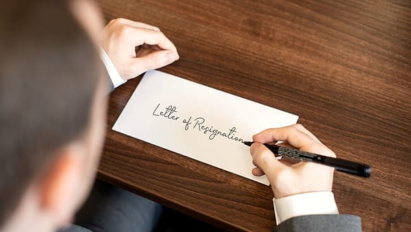 A handwritten letter lying on a desk, the script running across the page