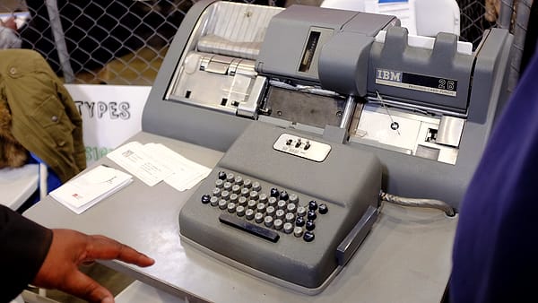A punch-card machine of the kind once used for payroll records