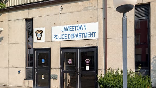 The entrance to a small-town police department with a sign above the door