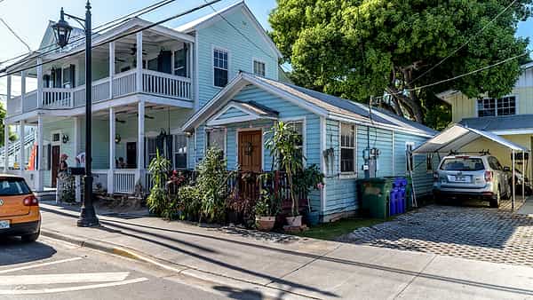 A painted timber house photographed from the street in daylight