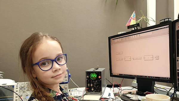 A young scientist working with instruments at a laboratory bench