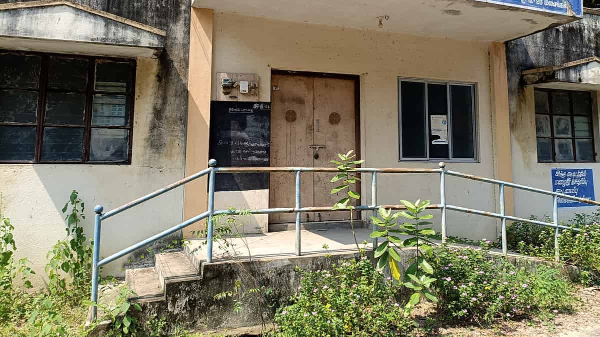 An abandoned government office with empty desks and bare shelves
