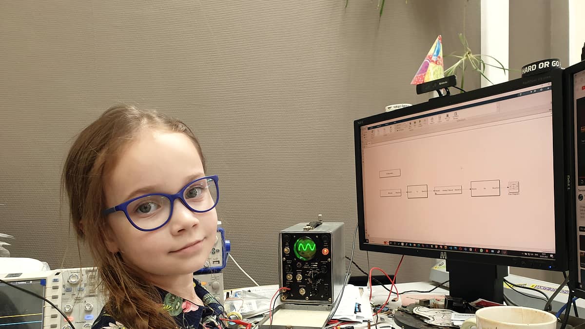 A young scientist working with instruments at a laboratory bench