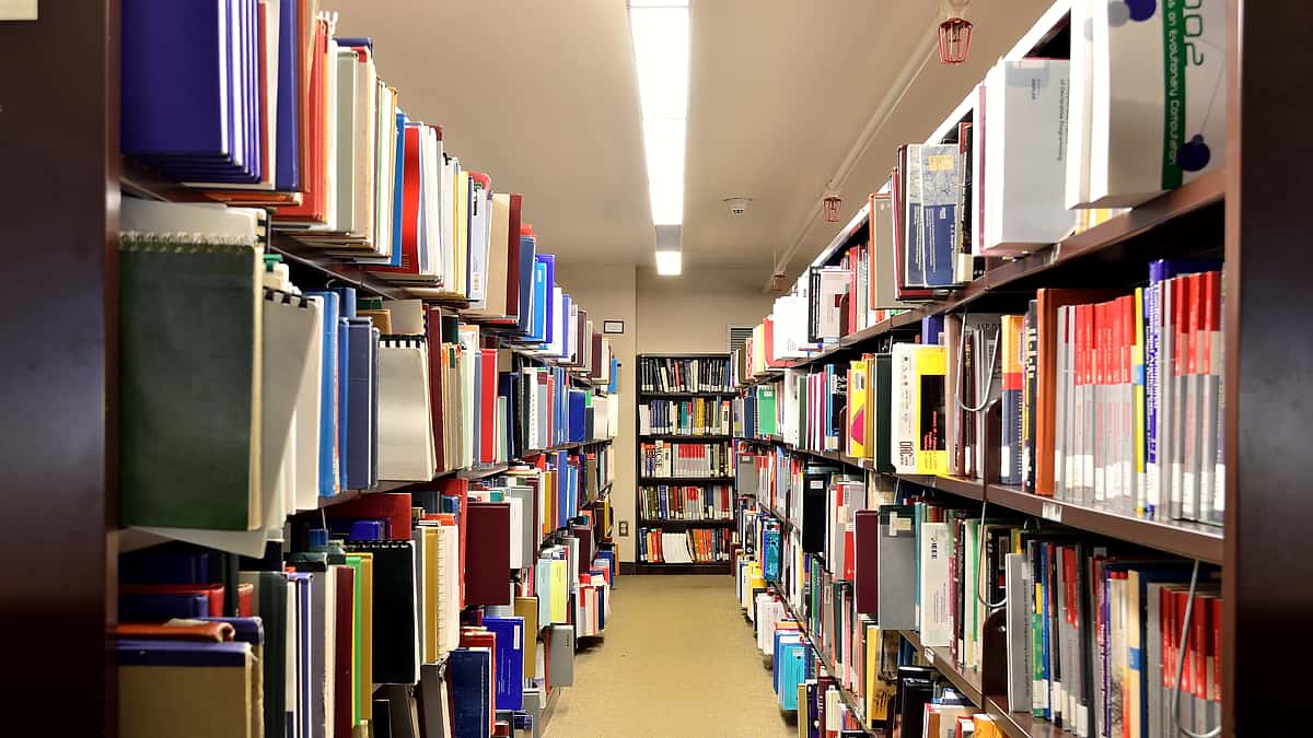 Library shelving filled with technical and engineering volumes